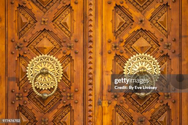wooden inlaid doors with ornate brass handles, zaragoza, aragon, spain, europe. - inlay stock pictures, royalty-free photos & images