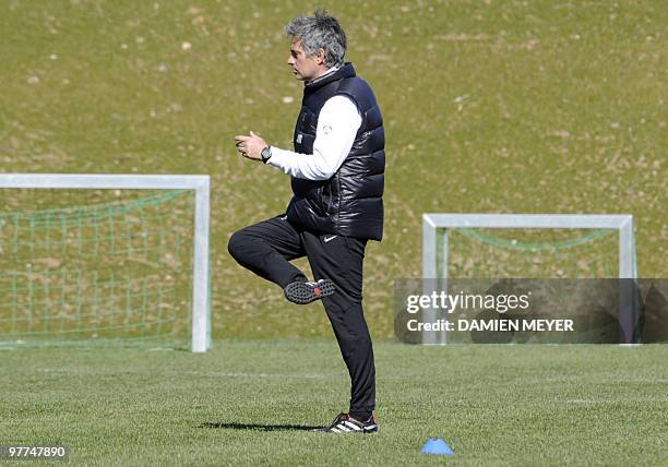 Inter Milan's Portuguese coach Jose Mourinho warms up during a training session of his team's on the eve of their UEFA Champions League football...