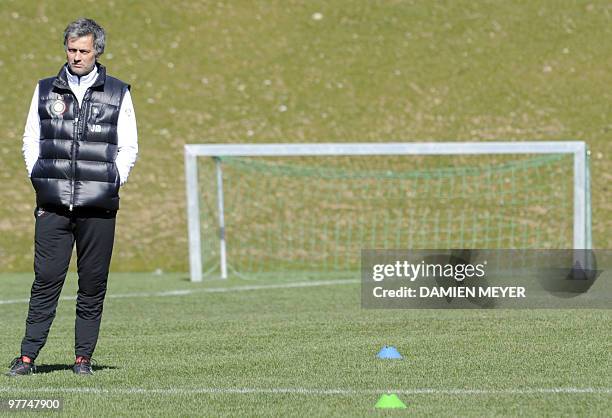 Inter Milan's Portuguese coach Jose Mourinho looks at his players during a training session of his team's on the eve of their UEFA Champions League...