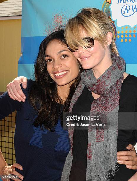 Actresses Rosario Dawson and Leslie Bibb attend the Make-A-Wish Foundation event at Santa Monica Pier on March 14, 2010 in Santa Monica, California.