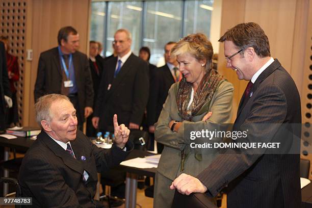 Germann Federal Minister of the Interior Wolfgang Schaeuble talks with Astrid Thors Minister of Migration of Finland and Austrian Interior Minister...