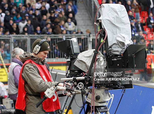 Cameraman handles a 3D television camera during the German first division Bundesliga football match Bayer 04 Leverkusen vs Hamburger SV in the...