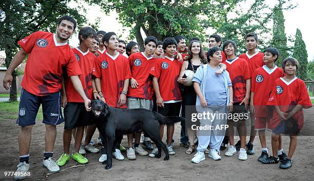 Members of the Club Atletico, Social y Deportivo Ernesto 'Che' Guevara", pose with Monica Nielsen , president of the club located in the town of...