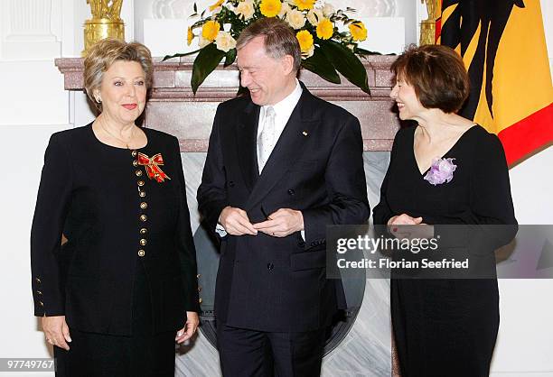 German President Horst Koehler and his wife Eva Luise Koehler and actress Marie-Luise Marjan pose for a picture after she received the Federal Cross...