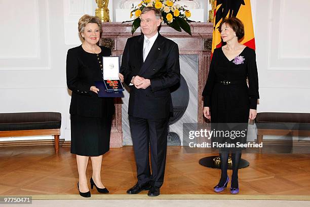 German President Horst Koehler and his wife Eva Luise Koehler and actress Marie-Luise Marjan pose for a picture after she received the Federal Cross...