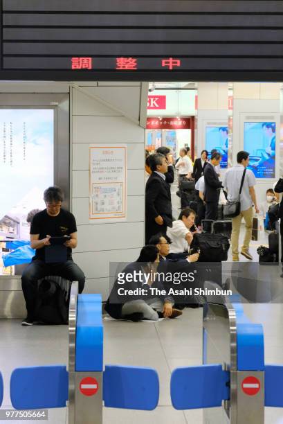 Passengers of Shinkansen are seen at Shin Osaka Station after the magnitude 6.1 strong earthquake suspending the service on June 18, 2018 in Osaka,...