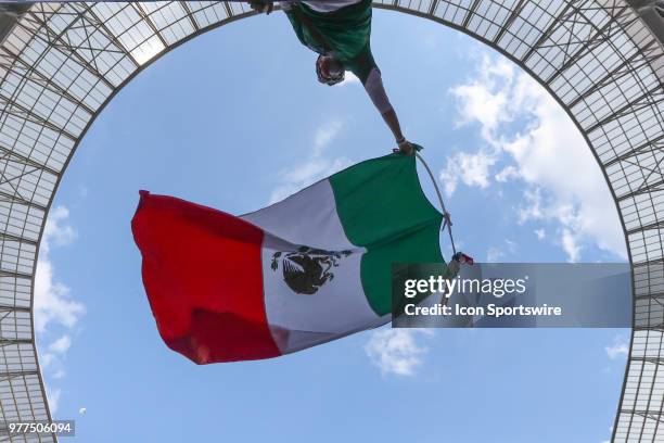 Mexico fan waves the Mexican flag during a Group F 2018 FIFA World Cup soccer match between Germany and Mexico on June 17 at the Kazan Arena in...