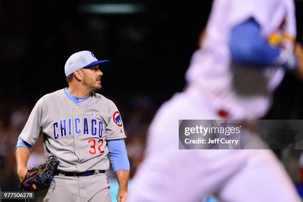 Brian Duensing of the Chicago Cubs looks on after giving up a solo home run to Matt Carpenter of the St. Louis Cardinals during the seventh inning at...