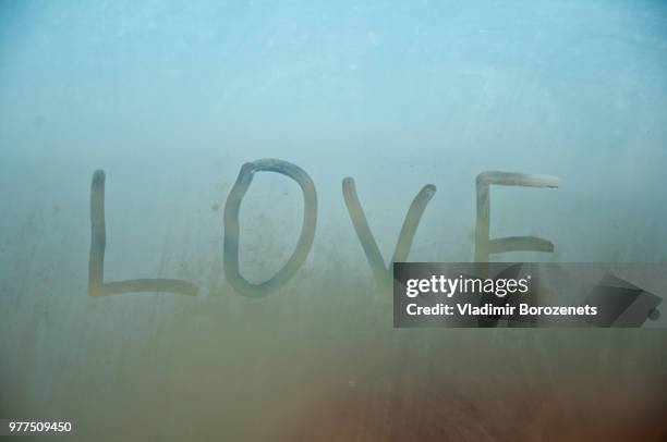 love on the window - roundworm stock pictures, royalty-free photos & images