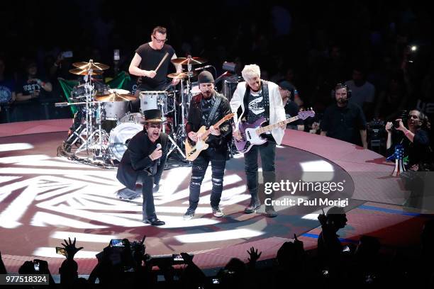 Bono, Larry Mullen, Jr., The Edge and Adam Clayton of U2 perform during the eXPERIENCE + iNNOCENCE TOUR at the Capital One Arena on June 17, 2018 in...