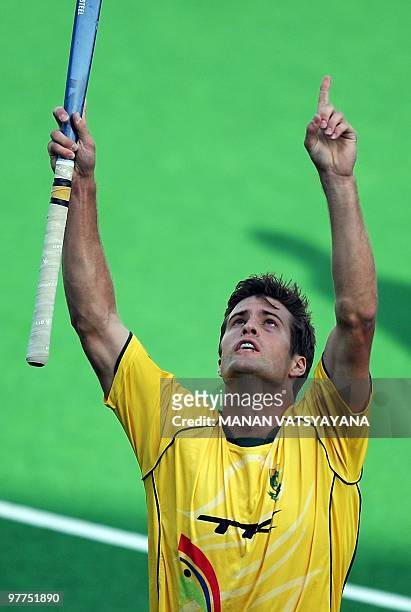 South African hockey player Lloyd Norris-Jones reacts after scoring a goal against New Zealand during their World Cup 2010 Classification match at...