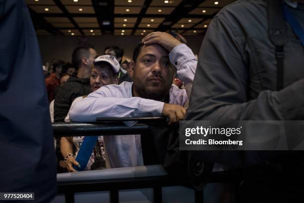 Supporters for Gustavo Petro, presidential candidate for the Progressivists Movement Party, not pictured, react during an election night rally in...