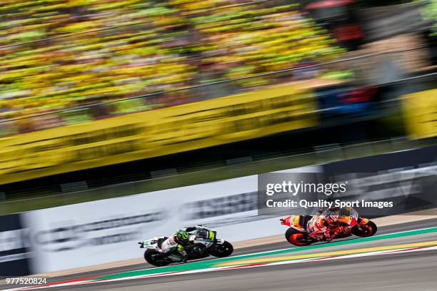 Dani Pedrosa of Spain and Repsol Honda Team rides ahead Cal Crutchlow of Great Britain and LCR Honda during MotoGP race of Catalunya at Circuit de...