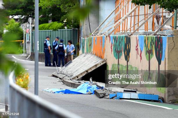 The site where a girl was killed after the walls beside an elementary school swimming pool fell on her after the magnitude 6.1 earthquake on June 18,...