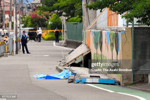 The site where a girl was killed after the walls beside an elementary school swimming pool fell on her after the magnitude 6.1 earthquake on June 18,...