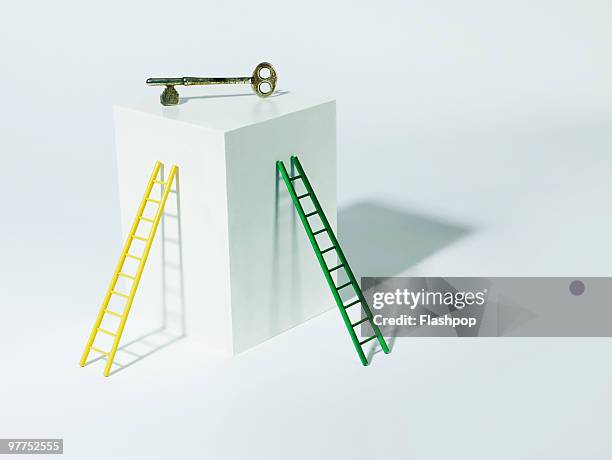 two ladders and a key - ladder leaning stock pictures, royalty-free photos & images