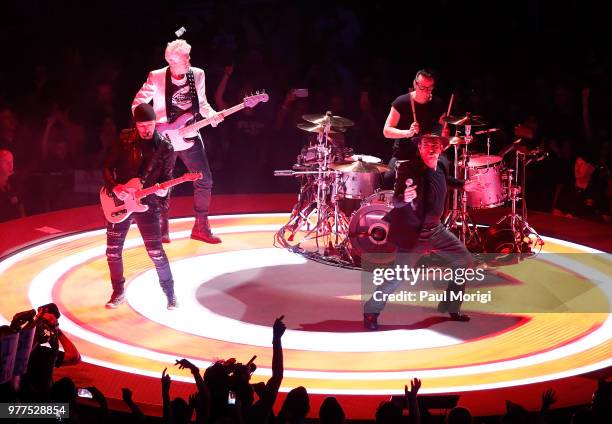 The Edge, Adam Clayton, Larry Mullen, Jr. And Bono of U2 perform during the eXPERIENCE + iNNOCENCE TOUR at the Capital One Arena on June 17, 2018 in...