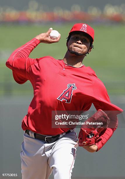 Starting pitcher Ervin Santana of the Los Angeles Angels of Anaheim pitches against the Kansas City Royals during the MLB spring training game at...