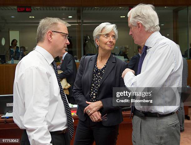 Michel Barnier, European Union internal market commissioner, right, speaks with Christine Lagarde, France's finance minister, center, and Olli Rehn,...