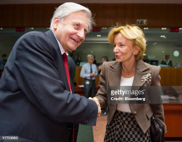 Jean-Claude Trichet, president of the European Central Bank, left, greets Elena Salgado, Spain's finance minister, at the meeting of European Union...