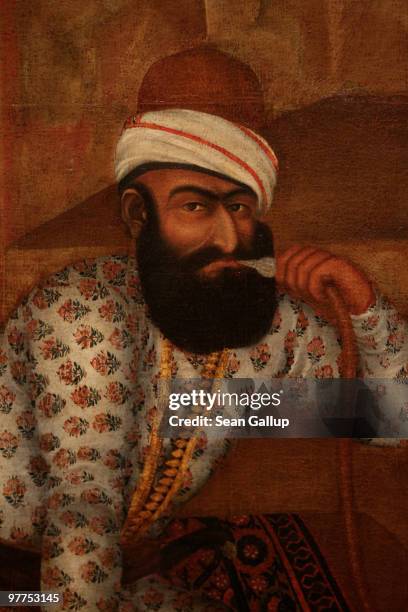 Karim Khan Zand looks out from an 18th century painting from Iran at the 'Treasures of the Aga Khan Museum - Masterpieces of Islamic Art' exhibition...