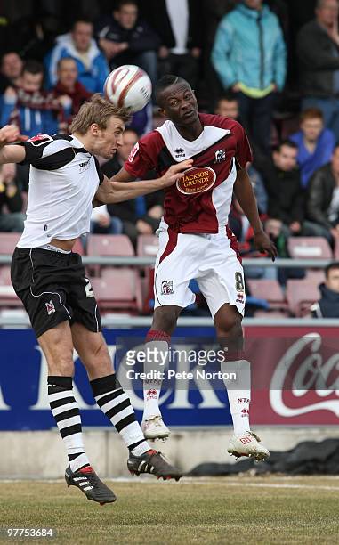 Gareth Waite of Darlington contests the ball with Abdul Osman of Northampton Town during the Coca Cola League Two Match between Northampton Town and...