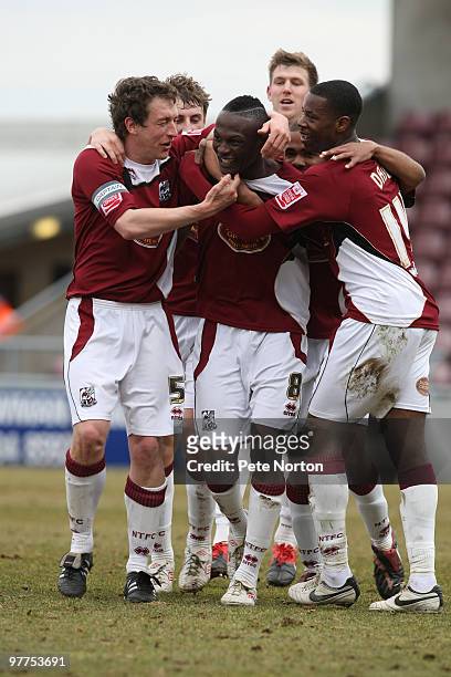 Abdul Osman of Northampton Town is congratulated by team mates after scoring his sides second goal during the Coca Cola League Two Match between...