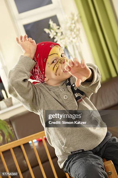 boy cased as tiger - playpen stock pictures, royalty-free photos & images