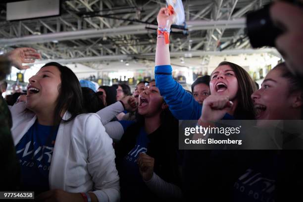 Supporters celebrate during an election rally for Ivan Duque, Colombia's president-elect, not pictured, at the party's headquarters in Bogota,...