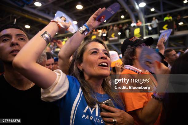 Supporters celebrate during an election rally for Ivan Duque, Colombia's president-elect, not pictured, at the party's headquarters in Bogota,...