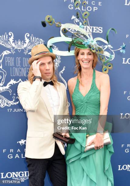 Designer Christophe Guillarme and Miss France1998 TV presenter Sophie Thalmann dressed by Christophe Guillarme and hat from Celine Cave attend the...