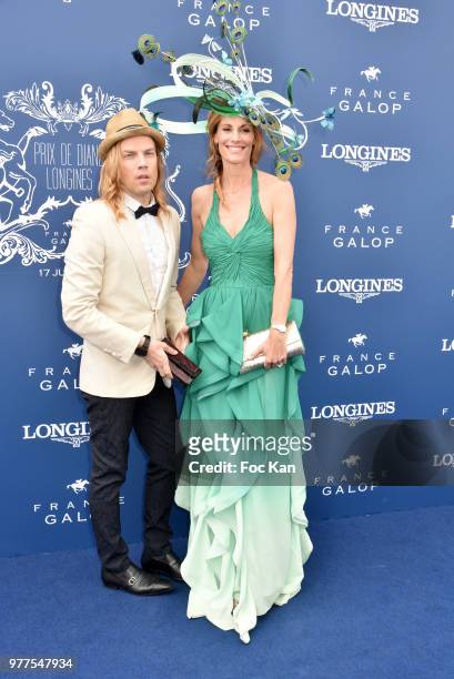 Designer Christophe Guillarme and Miss France1998 TV presenter Sophie Thalmann dressed by Christophe Guillarme and hat from Celine Cave attend the...