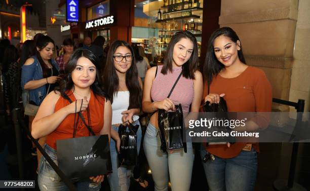 Customers show off their Morphe products during the Morphe store opening at the Miracle Mile Shops at Planet Hollywood Resort & Casino on June 16,...