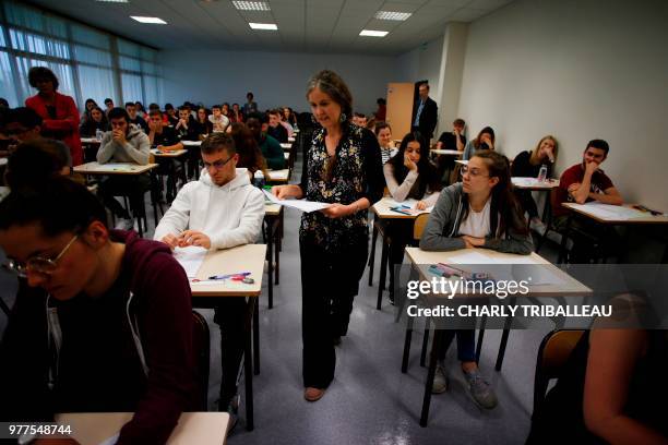 High school students are distributed subjects at the start of a 4 hours philosophy dissertation, that kicks off the French general baccalaureat exam...