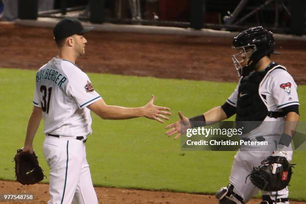 Relief pitcher Brad Boxberger of the Arizona Diamondbacks celebrates with catcher Alex Avila after defeating the New York Mets 7-3 in the MLB game at...