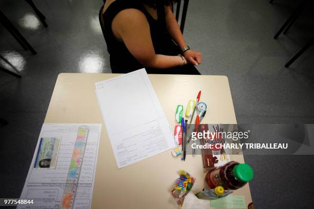 An high school student waits for the start of a 4 hours philosophy dissertation, that kicks off the French general baccalaureat exam for getting into...