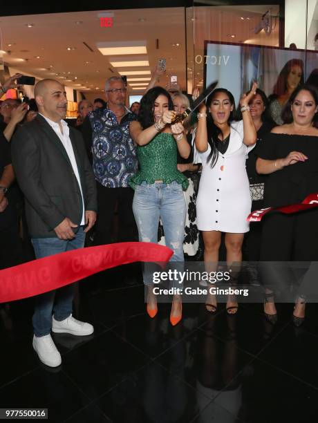 Morphe co-owner Chris Tawil, YouTube personality Jaclyn Hill and Morphe co-owner Linda Tawil cut a ribbon during Morphe store opening at the Miracle...