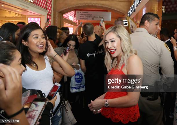 Customers speak with YouTube personality Rachel Barkules during Morphe store opening at the Miracle Mile Shops at Planet Hollywood Resort & Casino on...