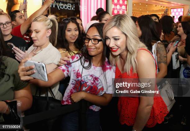 Customer takes a photo with YouTube personality Rachel Barkules during Morphe store opening at the Miracle Mile Shops at Planet Hollywood Resort &...