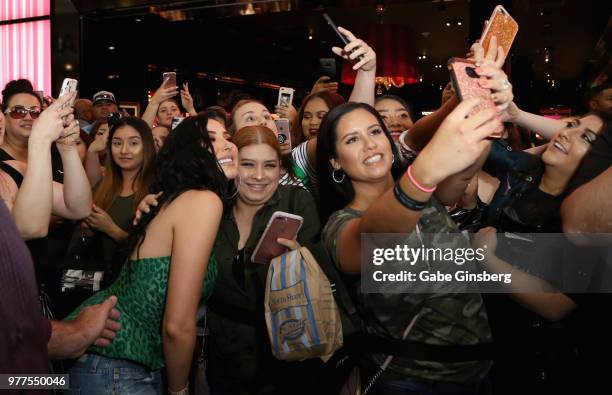 YouTube personality Jaclyn Hill takes selfies with fans during Morphe store opening at the Miracle Mile Shops at Planet Hollywood Resort & Casino on...