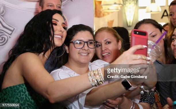 YouTube personality Jaclyn Hill takes selfies with fans during Morphe store opening at the Miracle Mile Shops at Planet Hollywood Resort & Casino on...