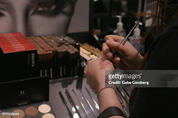 Customer tests makeup shades during Morphe store opening at the Miracle Mile Shops at Planet Hollywood Resort & Casino on June 16, 2018 in Las Vegas,...
