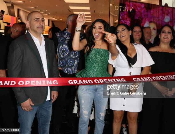 Morphe co-owner Chris Tawil, YouTube personality Jaclyn Hill and Morphe co-owner Linda Tawil prepare to cut a ribbon cutting during Morphe store...