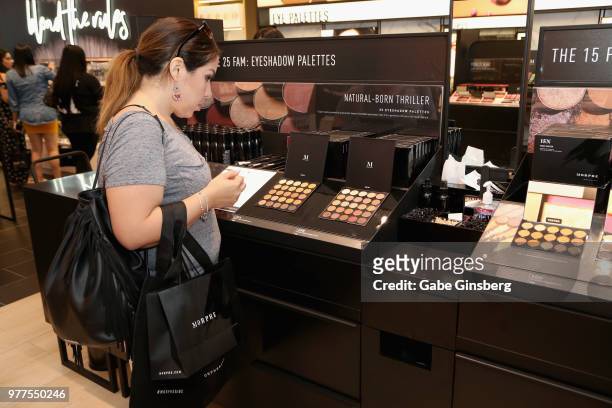 Customer looks at makeup products during a Morphe store opening at the Miracle Mile Shops at Planet Hollywood Resort & Casino on June 16, 2018 in Las...