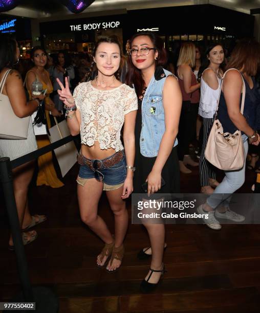 Customers pose during a Morphe store opening at the Miracle Mile Shops at Planet Hollywood Resort & Casino on June 16, 2018 in Las Vegas, Nevada.