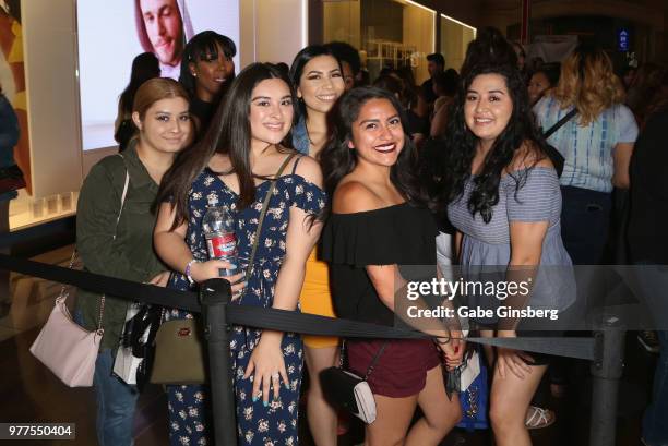 Customers pose during a Morphe store opening at the Miracle Mile Shops at Planet Hollywood Resort & Casino on June 16, 2018 in Las Vegas, Nevada.