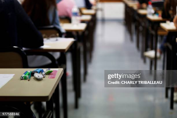 High school students wait for the start of a 4 hours philosophy dissertation, that kicks off the French general baccalaureat exam for getting into...