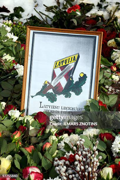 This picture taken on March 16, 2010 shows a wreath with an inscription which translates as :"16 of March Latvian legionaries commemoration day" laid...