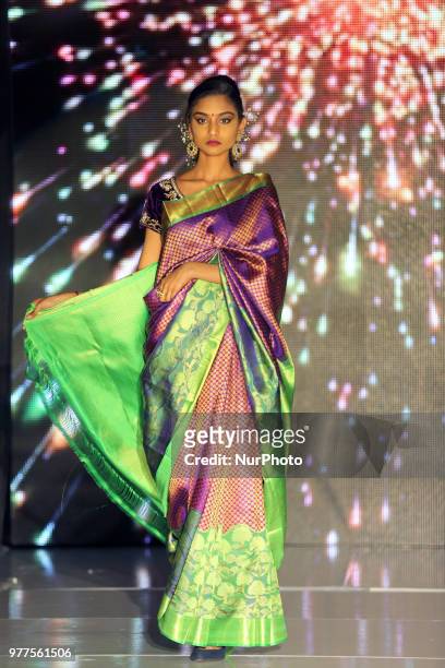 Indian model wearing an elegant and ornate Kanchipuram saree during a South Indian bridal fashion show held in Scarborough, Ontario, Canada.