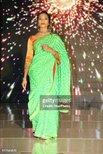 Indian model wearing an elegant designer saree during a South Indian bridal fashion show held in Scarborough, Ontario, Canada.